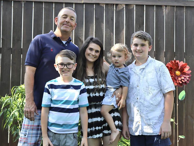 Danny Saxon (far right) with his family, from left: sons Keegan and Kole, wife Morgan and son Kyler. (Photo courtesy of the Saxon family)